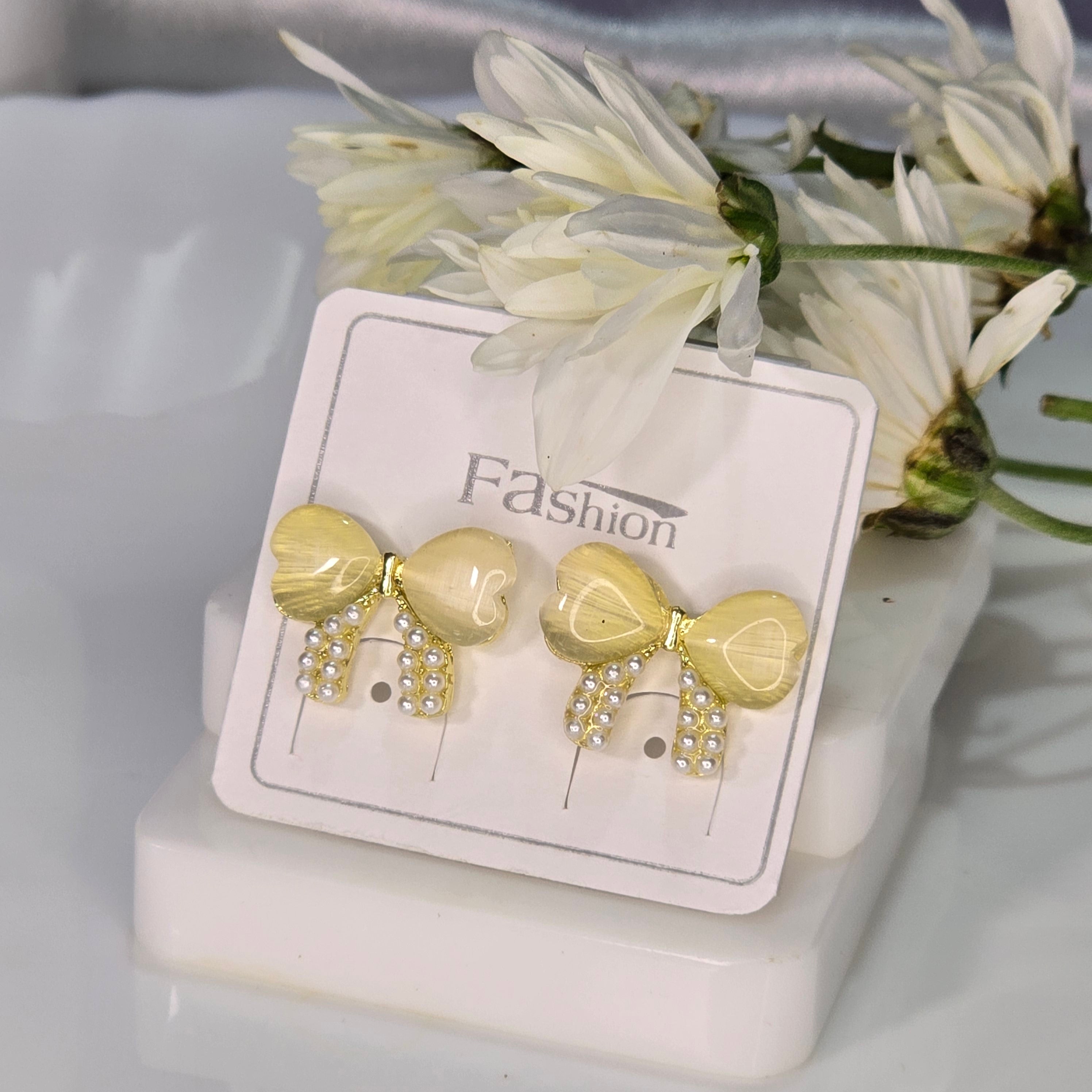 AK00048 - Golden Ribbon Bow Stud Earrings – Yellow Cat’s Eye & Pearl Accents
