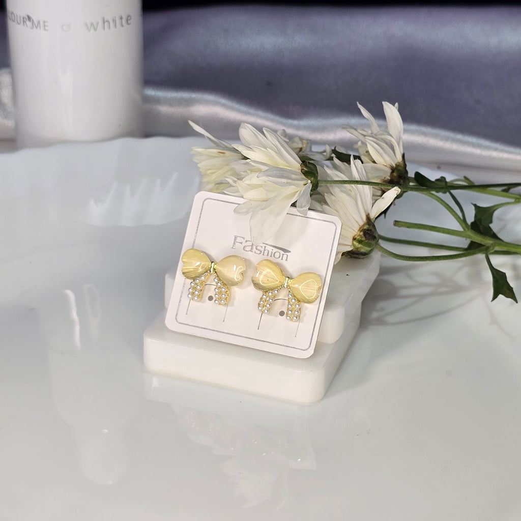 AK00048 - Golden Ribbon Bow Stud Earrings – Yellow Cat’s Eye & Pearl Accents