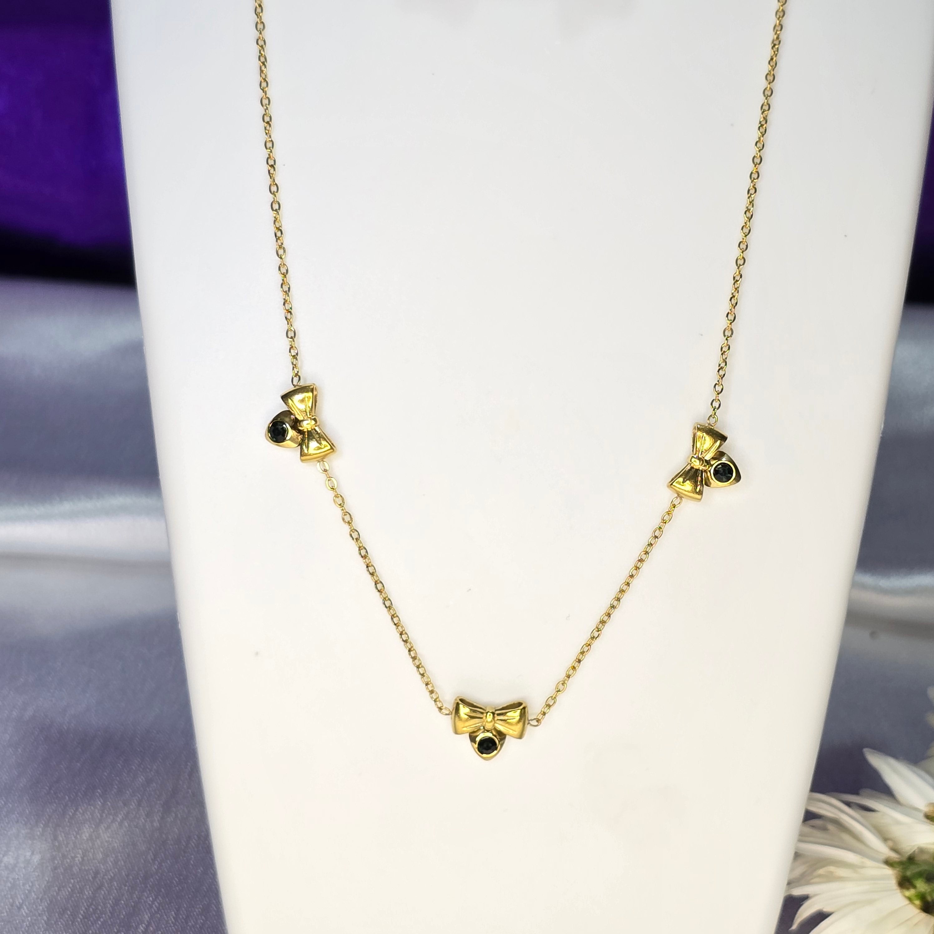 AK00085 - Aria Sparkling Bow Necklace & Earring Set