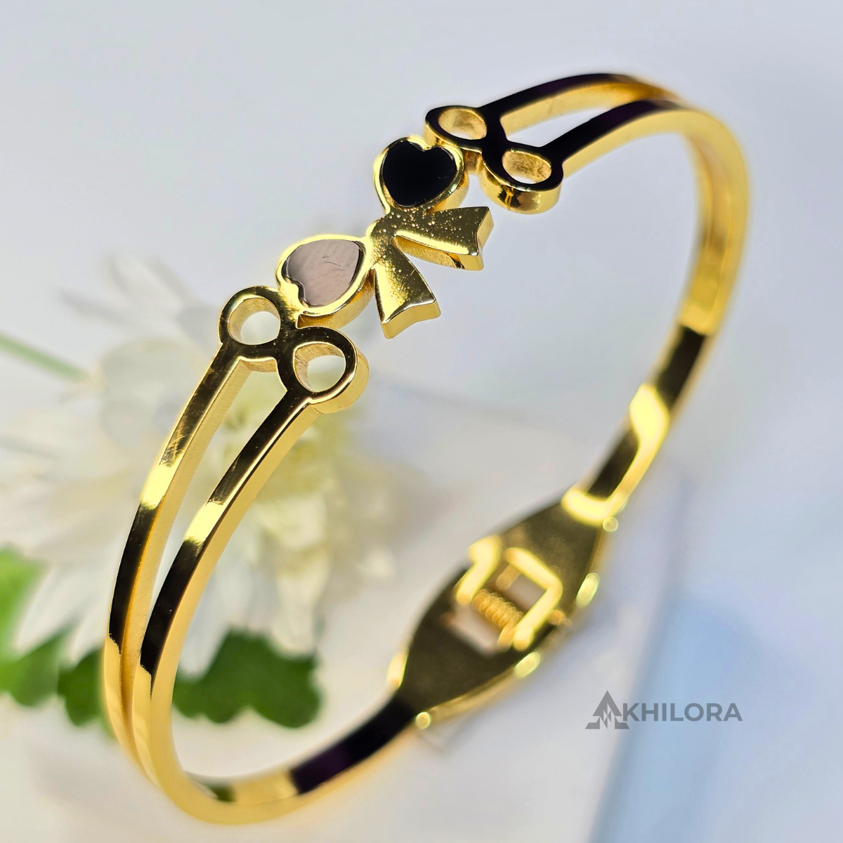 AK00164 - Chic Bowknot Gold-Plated Bangle with Black Heart Inlay