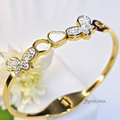 AK00167 - Flutter of Love Gold-Plated Bangle with Rhinestone Butterflies & Heart