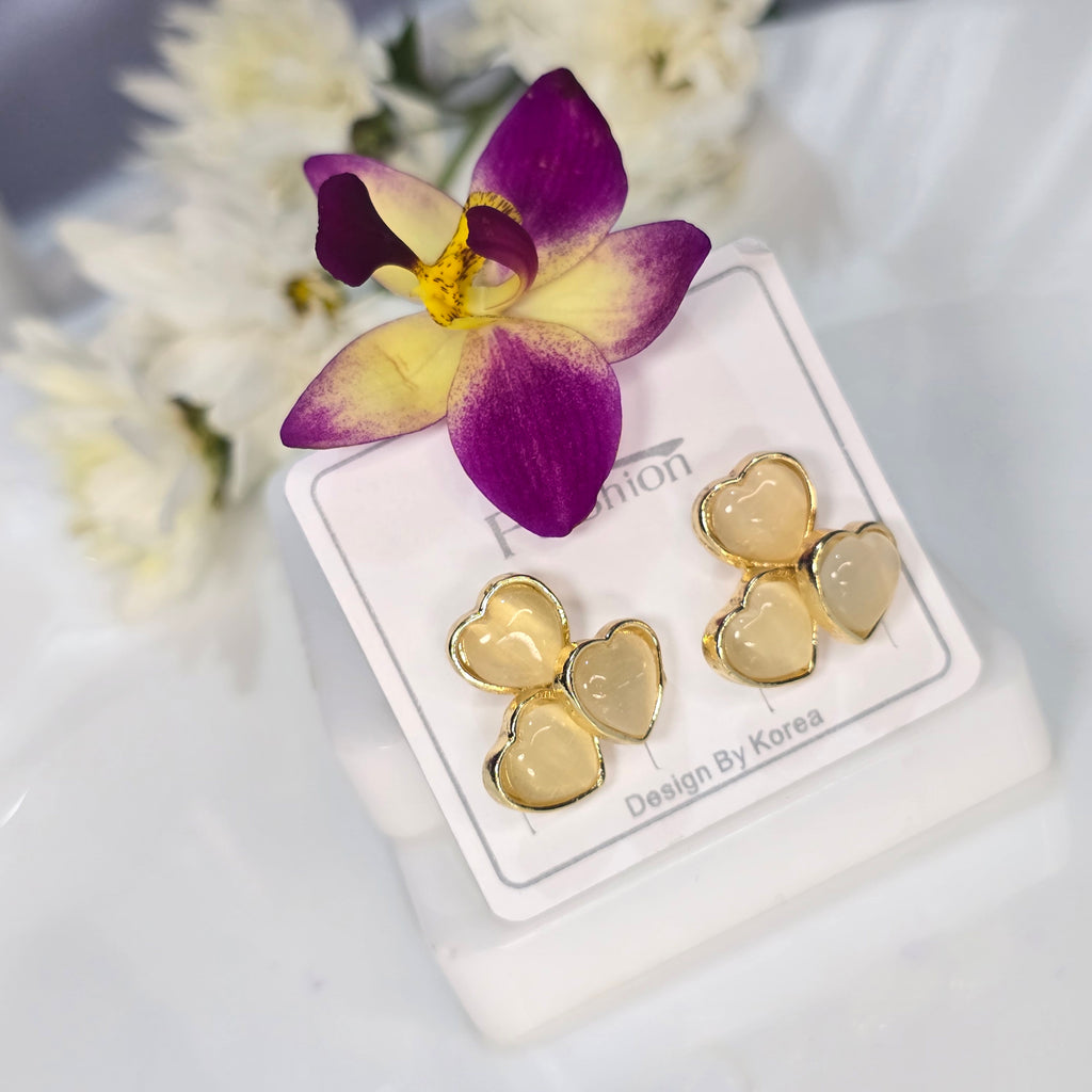 AK00063 - Triple Love Golden Cream Heart Studs