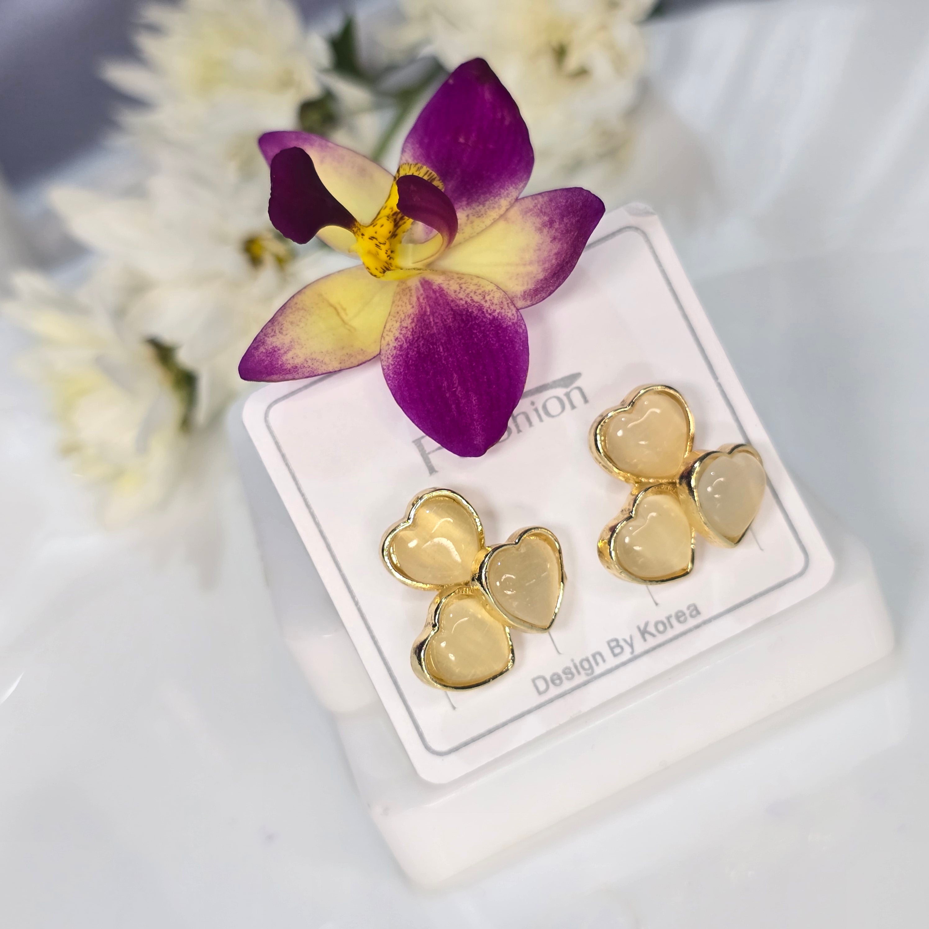 AK00063 - Triple Love Golden Cream Heart Studs