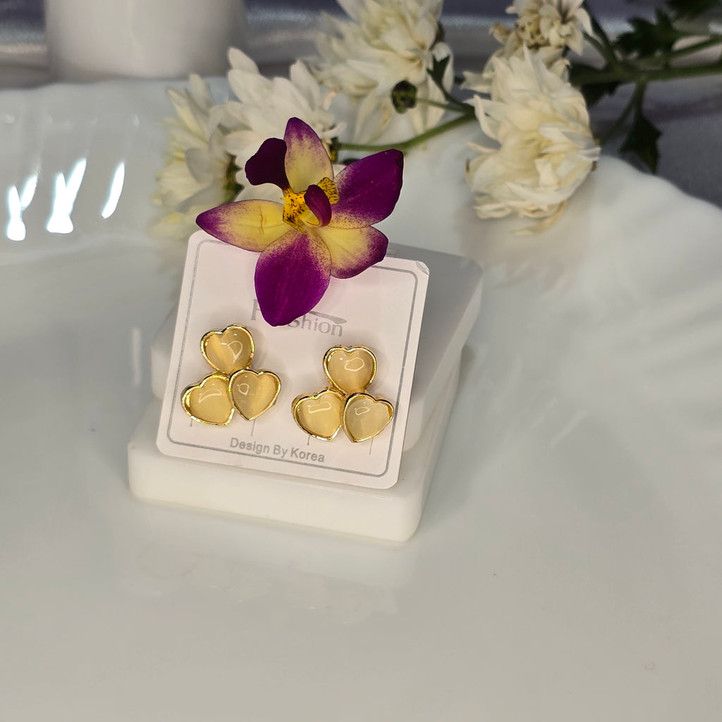 AK00063 - Triple Love Golden Cream Heart Studs